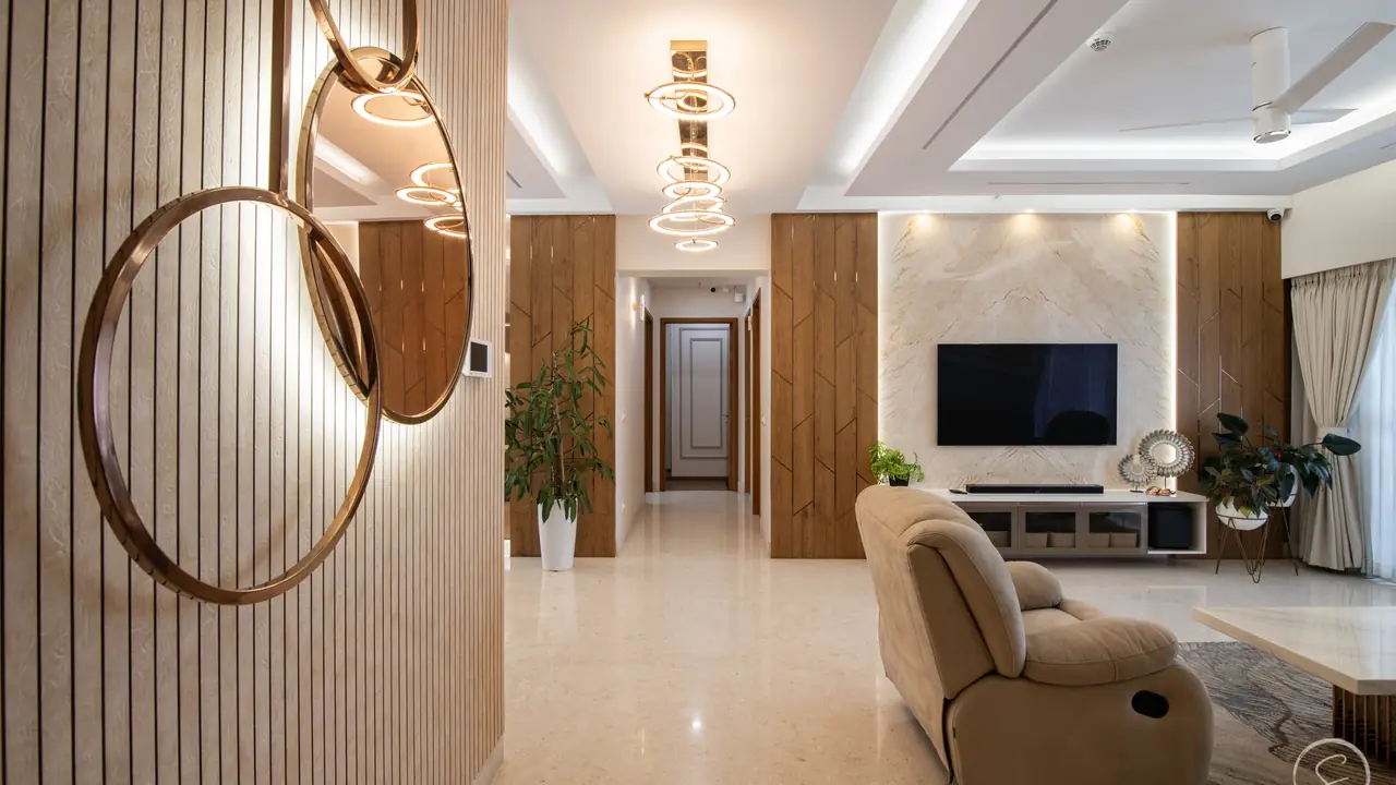 Living room with a round mirror on slatted wood, a recliner and a cove-lit ceiling